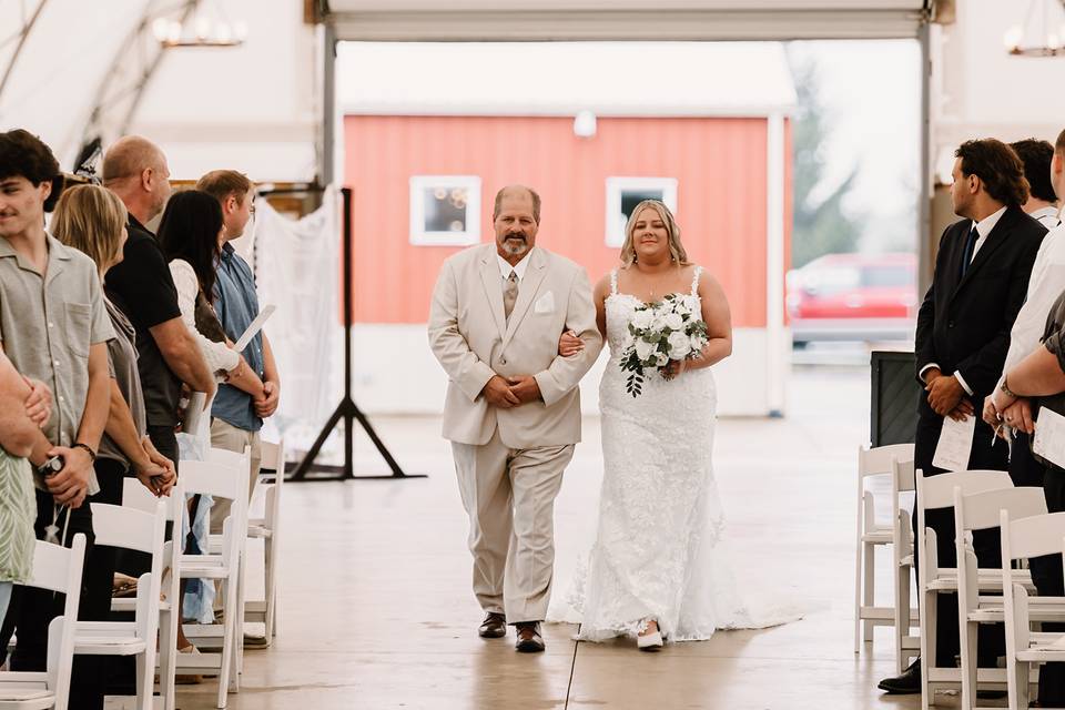 Father and bride walking down