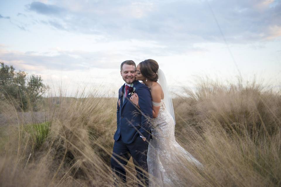 Bride kissing groom