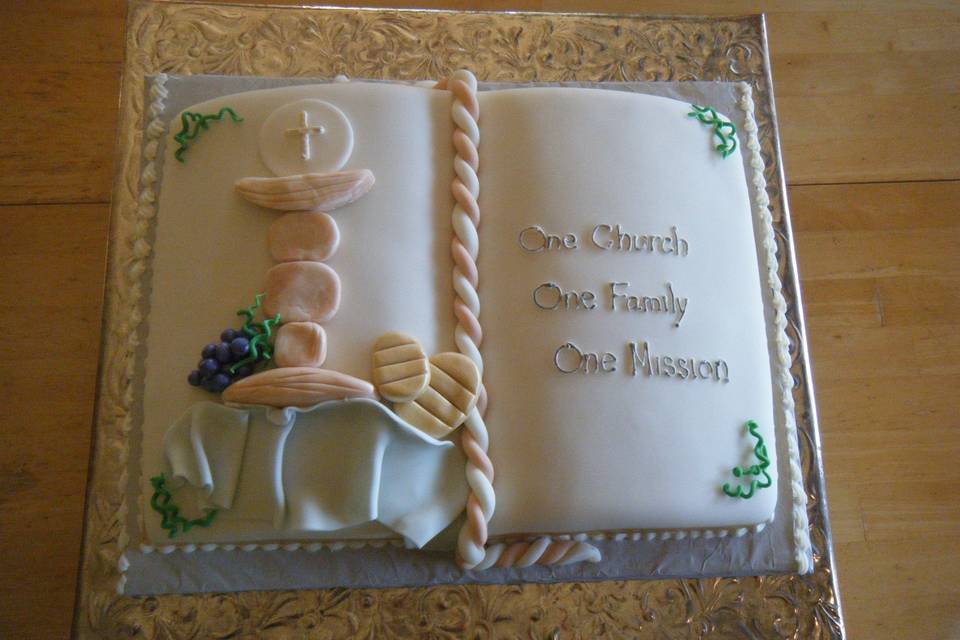 Special cake for Father Oscar in the shape of an open Bible