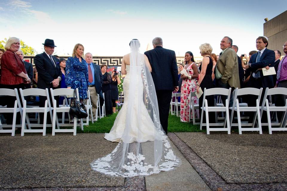 Ceremony in the outdoor Courtyard with the Mosaic and sky as your backdrop