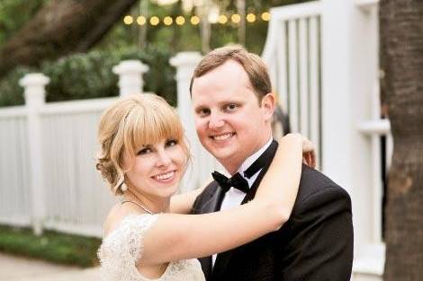 Southern bride, Allison, wore a custom Jessica lace bridal gown with cap sleeves and a deep V back by Modern Trousseau for her Charleston wedding. Image courtesy of Evan Laettner Photography.