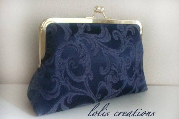 Simple, elegant, traditional clutch that is suitable for both formal and informal weddings or just for evening fun. THE FLOWER IS REMOVABLE AND SOLD SEPARATELY. http://www.etsy.com/listing/65571176/lolis-flower-by-lolis-creations
Choose the color you like.
It was made with a lot of care and love!!!!!!
FEATURES:
Outer fabric – 100% cotton (canvas).
Silver or antique brass color hardware.
Frame top (8