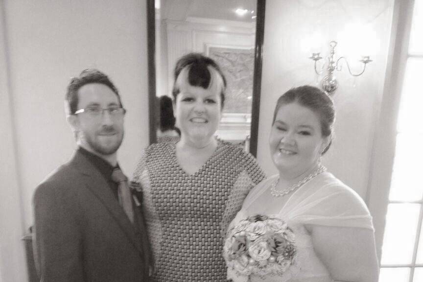 Newlyweds with the officiant