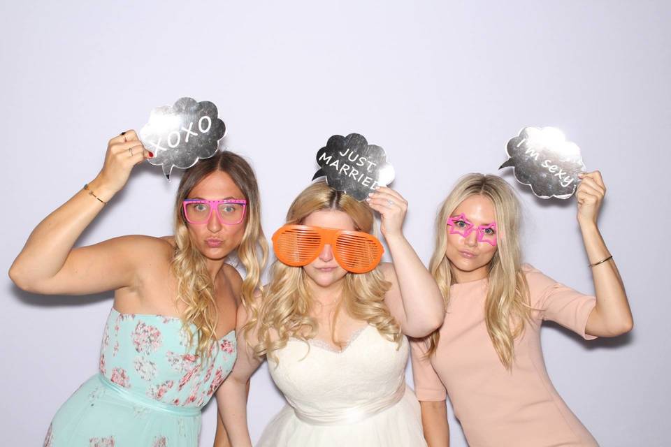 Bride and bridesmaids in the booth