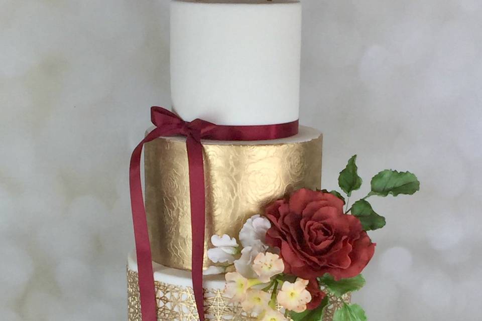 Gold and burgundy with handmade sugar flowers