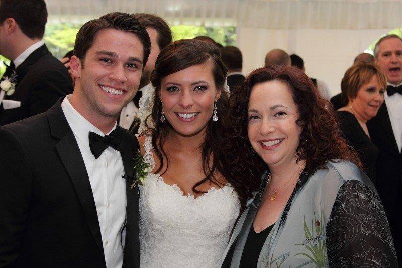 Newlyweds with officiant