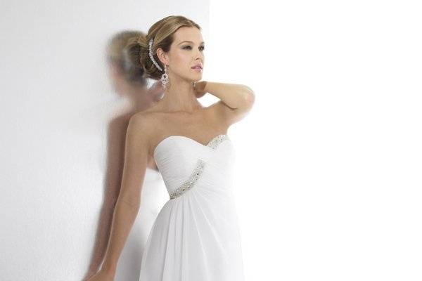 Style T527 is a flowing chiffon A-line. The sweetheart neckline is accented with beading.