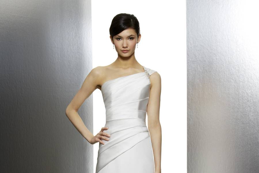 Style # 591Fall 2013Satin is draped to create this one shoulder trumpet. A beaded motif with Swarovski crystals accents the one shoulder cap sleeve.