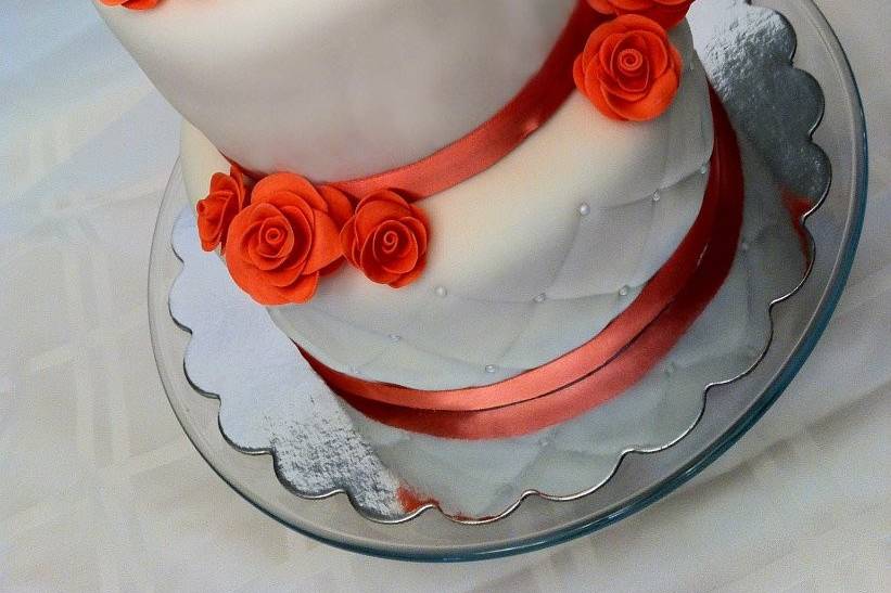 Simple fondant covered cake with handmade fondant coral roses