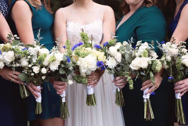 The bride and bridesmaids holding their bouquet
