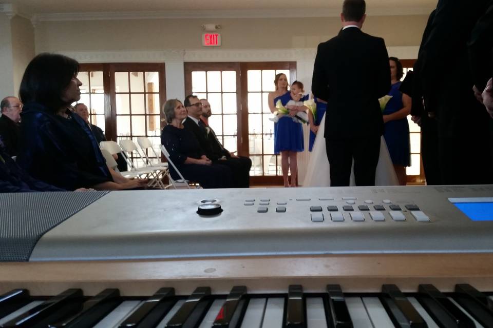 I'd be happy to play live music for you while you walk down the isle, just like in this wedding :)