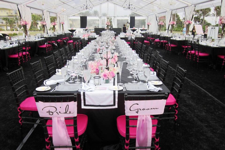 A very playful bride whose reception was pretty in pink and black. This clear span clear top tent was positioned beachfront at the hammock beach resort palm coast florida