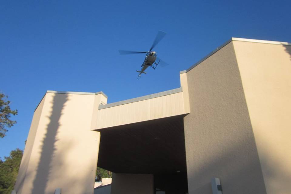 Helicopter cresting blessed trinity preparing for shower of rose petals