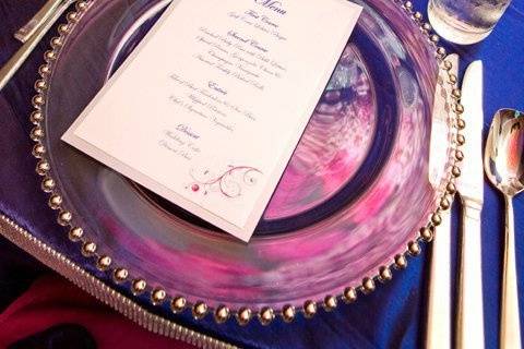 Details of the table appointments silver beaded charger plates, crystal framed table numbers, menu cards and more