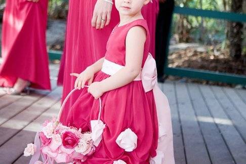 The littlest flower girl adorable in her floral headpiece