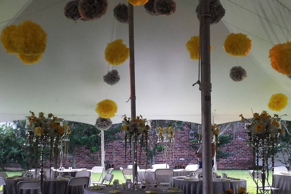 Silver grey and yellow puff balls on tent ceiling