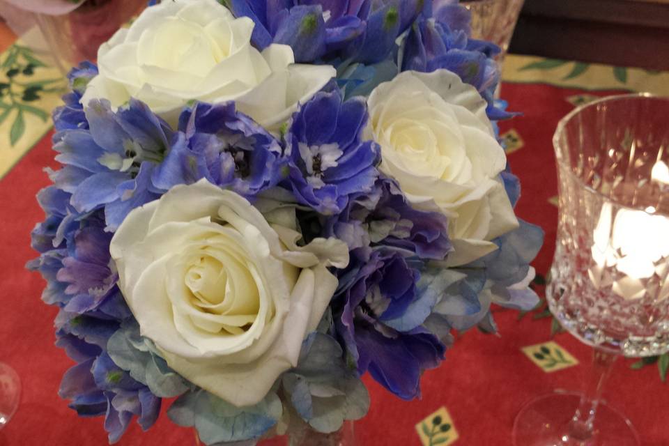 Blue hydrangea, white roses and blue delphinium nosegay