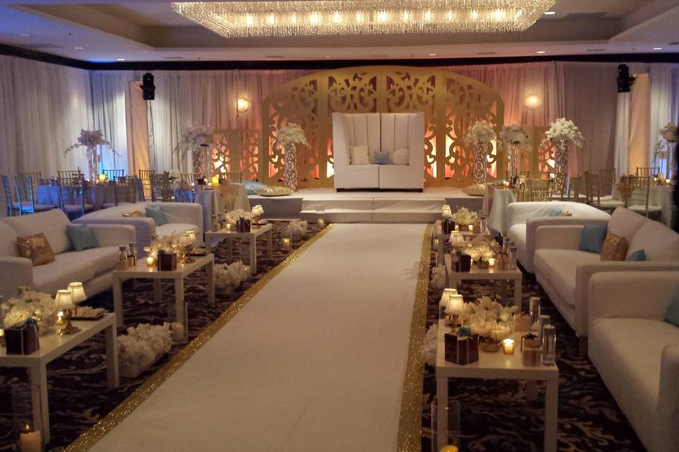 Scroll background, sofa groupings and floral decor... Draping and lighting