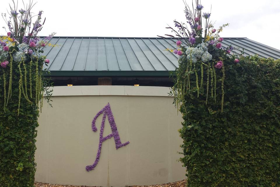 Floral letter and cascading wall flowers deer creek country club jacksonville. Fl