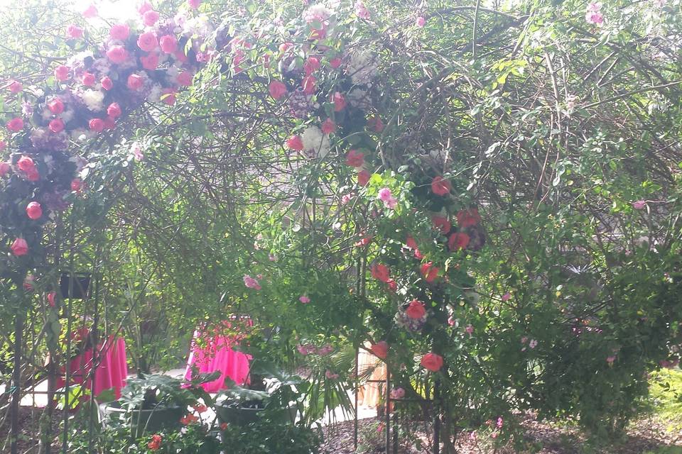 Garden club arbor accented with sprays of roses