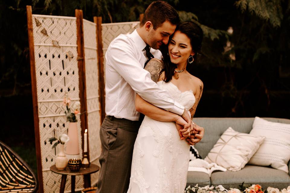 Groom embraces his bride