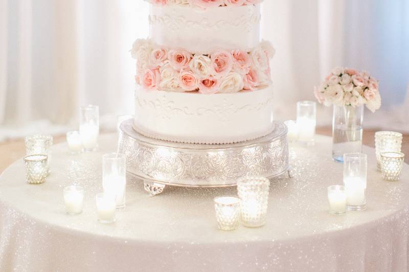 White cake with pink flowers