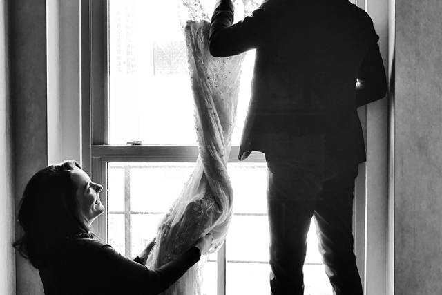 Videographer hangs the dress