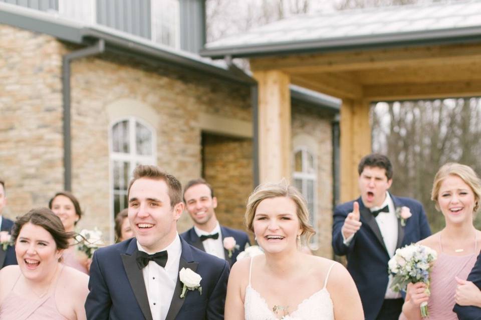 The couple together with their bridesmaids and groomsmen