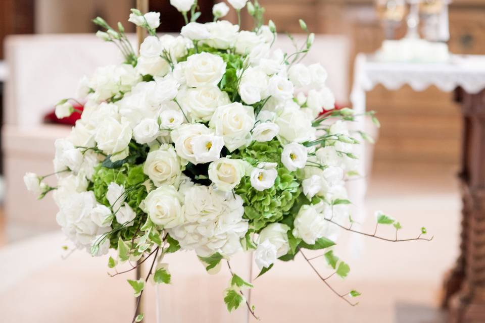 White & green hydrangeas, roses and delphiniums for a church arrangement