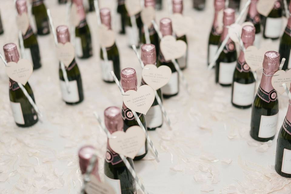 Pink champagne as escort cards