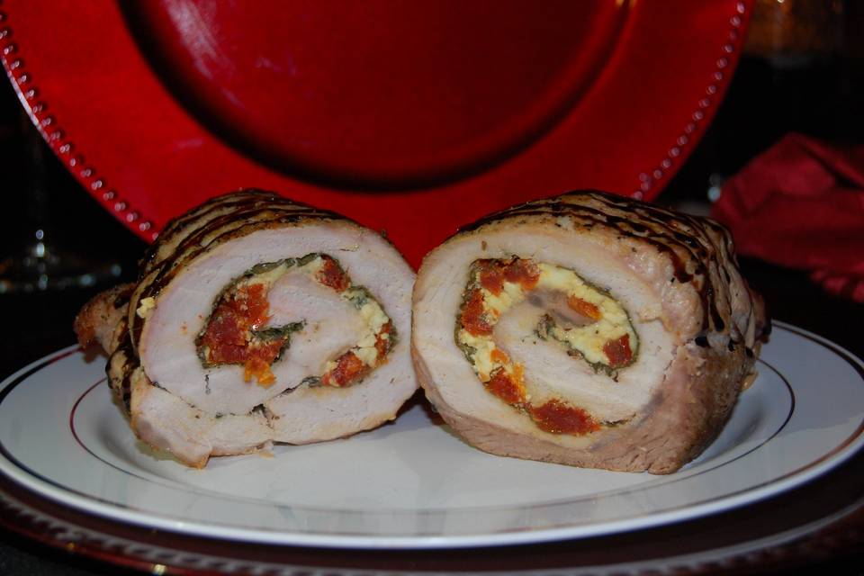 Pork Roulade stuffed with spinach, sun dried tomatoes and Gorgonzola cheese with a balsamic glaze