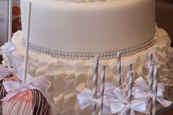 Beautiful all white wedding cake designed to match brides dress!