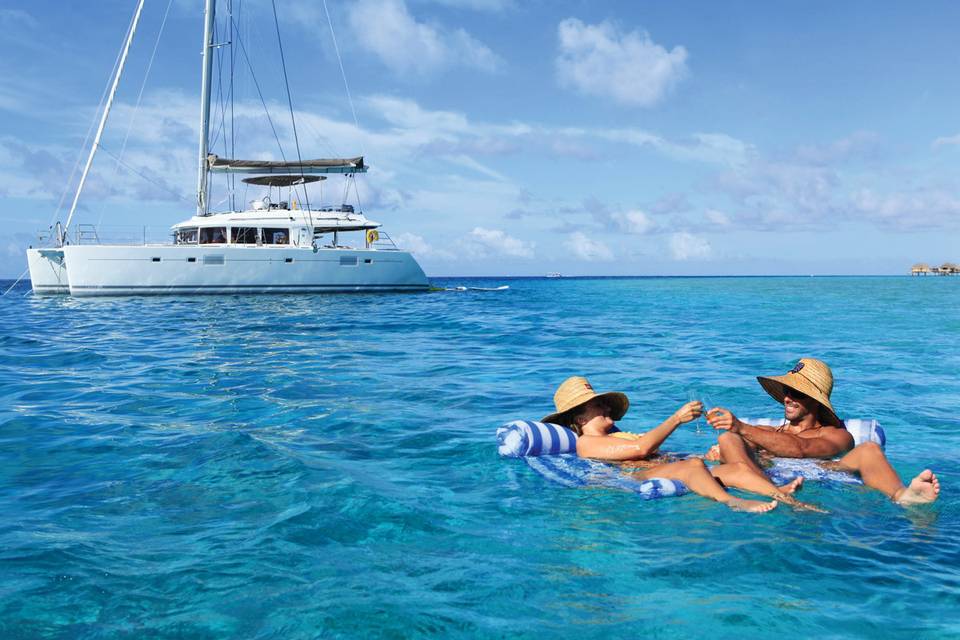 Enjoying the lagoon on a private Tahiti Yacht Charter cruise | Honeymoons by Tahiti.com