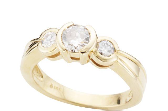 Yellow gold engagement with with three round diamonds designed by Spectrum Art & Jewelry