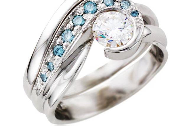 Custom Designed Round Diamond engagement ring with blue diamond accents and matching wedding band by Spectrum Art & Jewelry