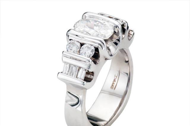 Custom Restyled Engagement Ring with Oval center, round and baguette accent diamonds by Spectrum Art & Jewlery