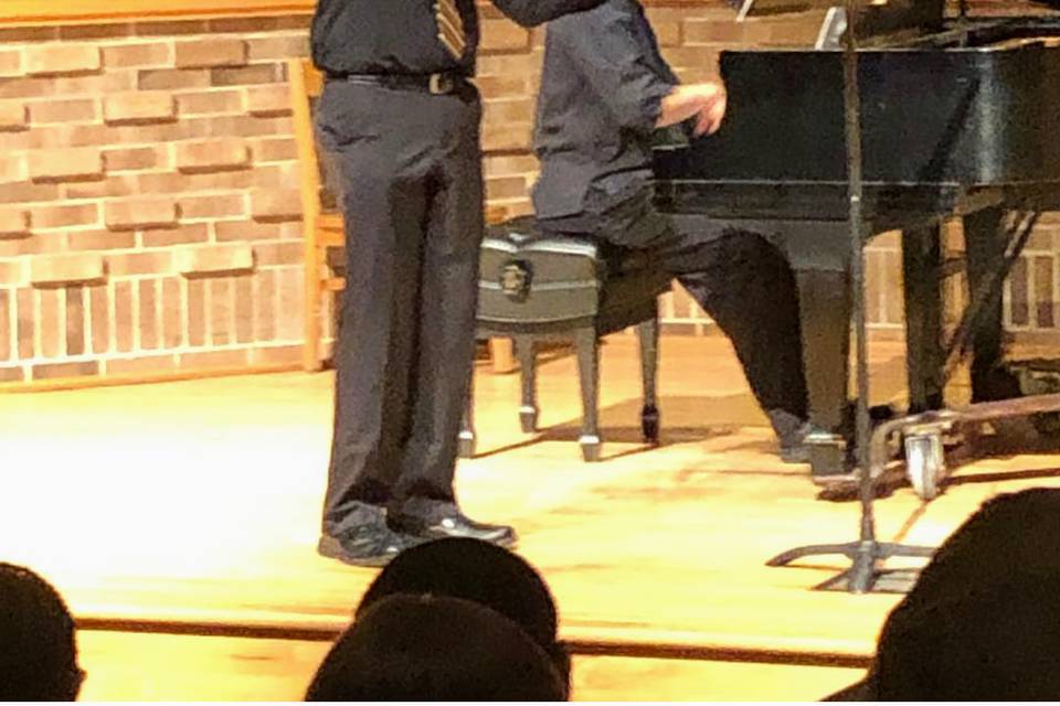 Mr. Faircloth giving a recital