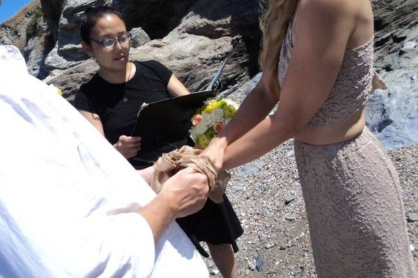 Officiating handfasting ceremony at wedding on Catalina Island.