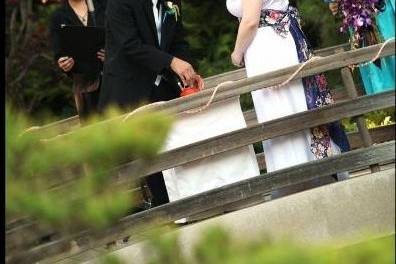Sake ceremony officiant at Cal State Long Beach Wedding in Earl Burns Miller Japanese Garden.  Photo by CW Photography.