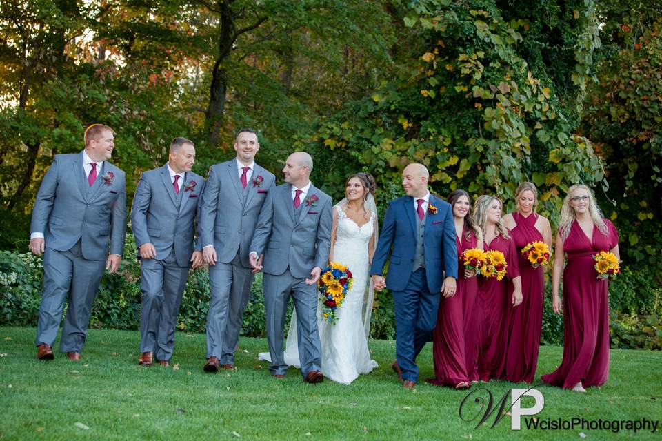 Bridesmaids and groomsmen with couple
