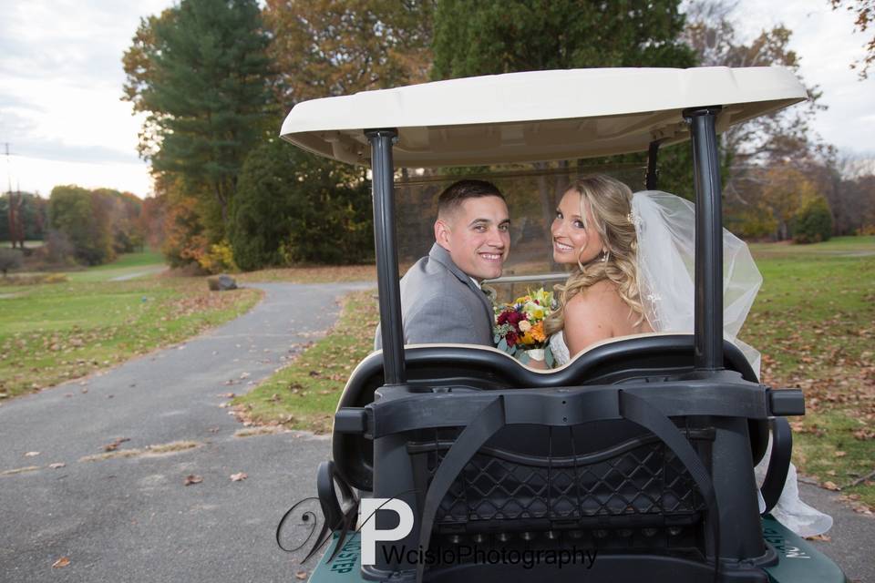 Couple in golf cart