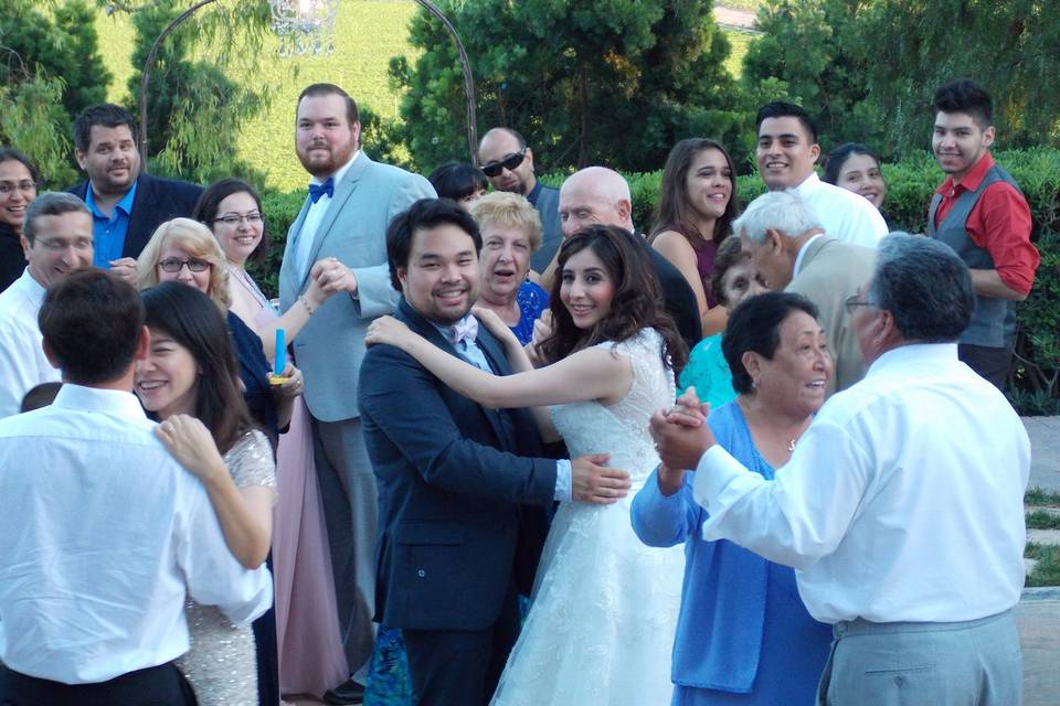 The couple and guests dancing