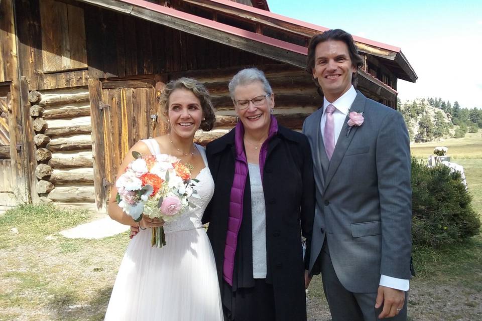 Newlyweds with the officiant