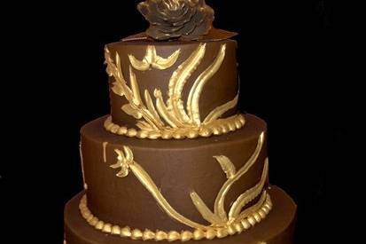 Dark chocolate butter creme with metallic edible gold accents make for an unusual yet elegant design.
