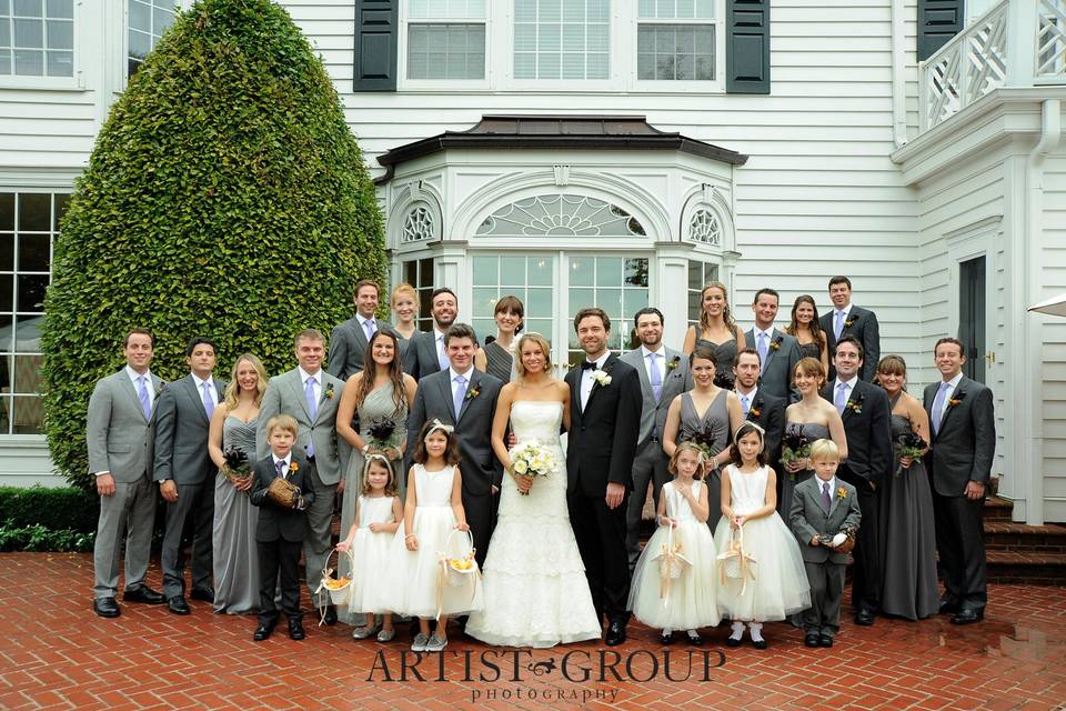 The couple with the bridesmaids and groomsmen