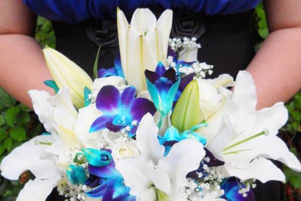 Elegant bouquet of Casablanca lilies and blue orchids.