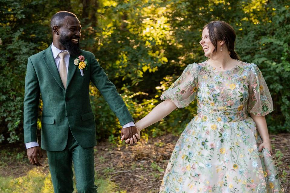 Joyful newlyweds walking hand-