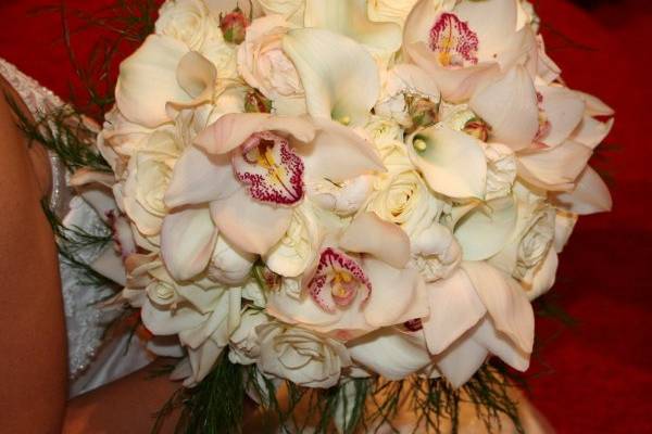 Bridal Bouquet with cymbidium orchids, garden roses, roses, and calla lilies.