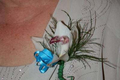 Cymbidium orchid pin on corsage.