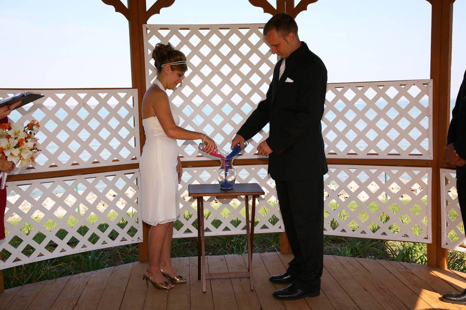 Pouring of sand to symbolize unity and a keepsake to save forever!